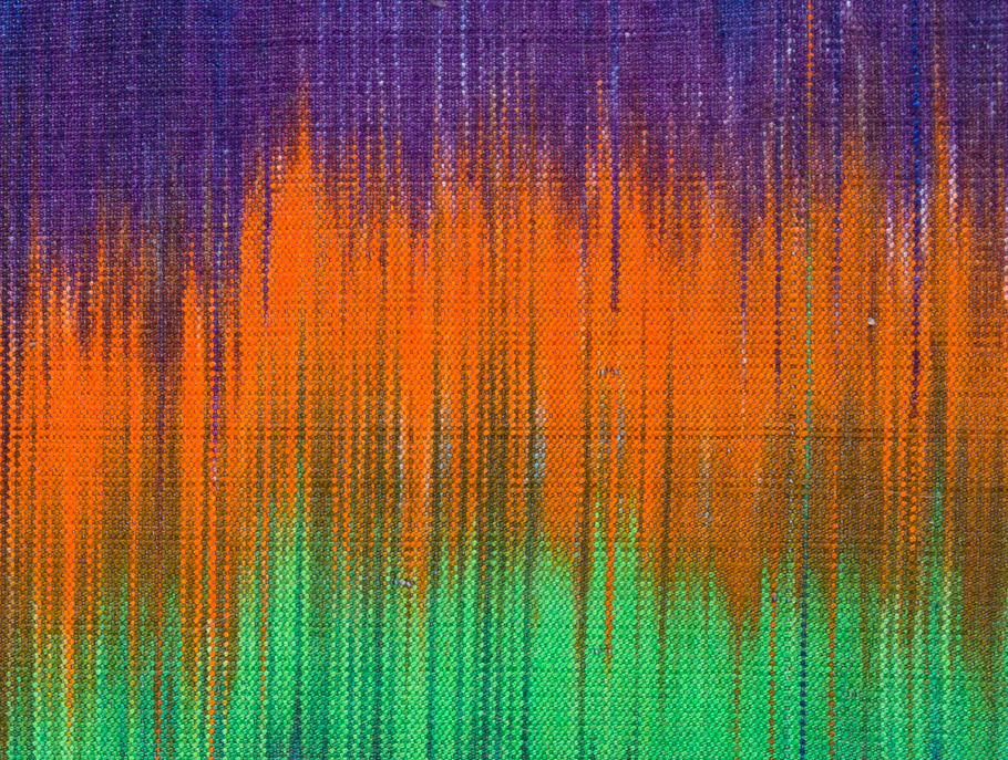 Image of a piece woven in triadic colors (purple, cyan-green, and orange).